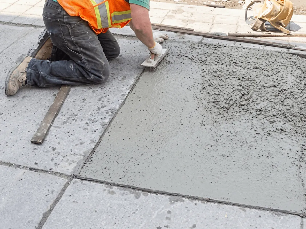 Professional repairing a concrete floor in Overland Park, KS