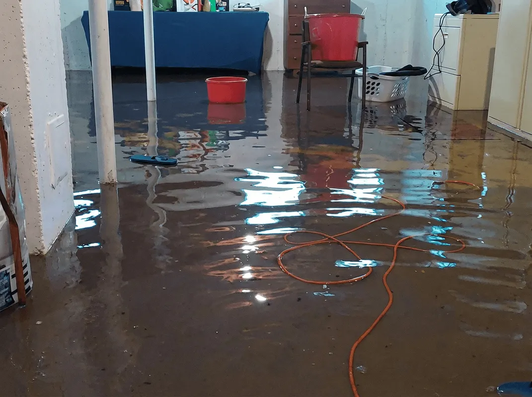 Basement with boiler, cabinets and washing machine completely flooded in Overland Park, KS